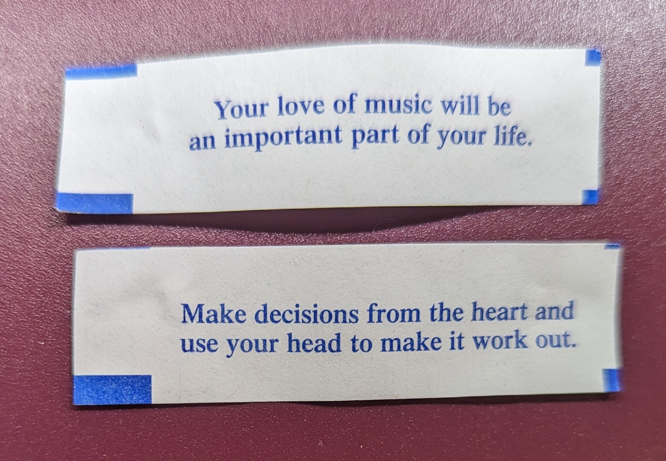 two fortune cookie paper slips