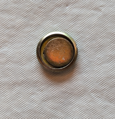 small magnet in steel cup or housing